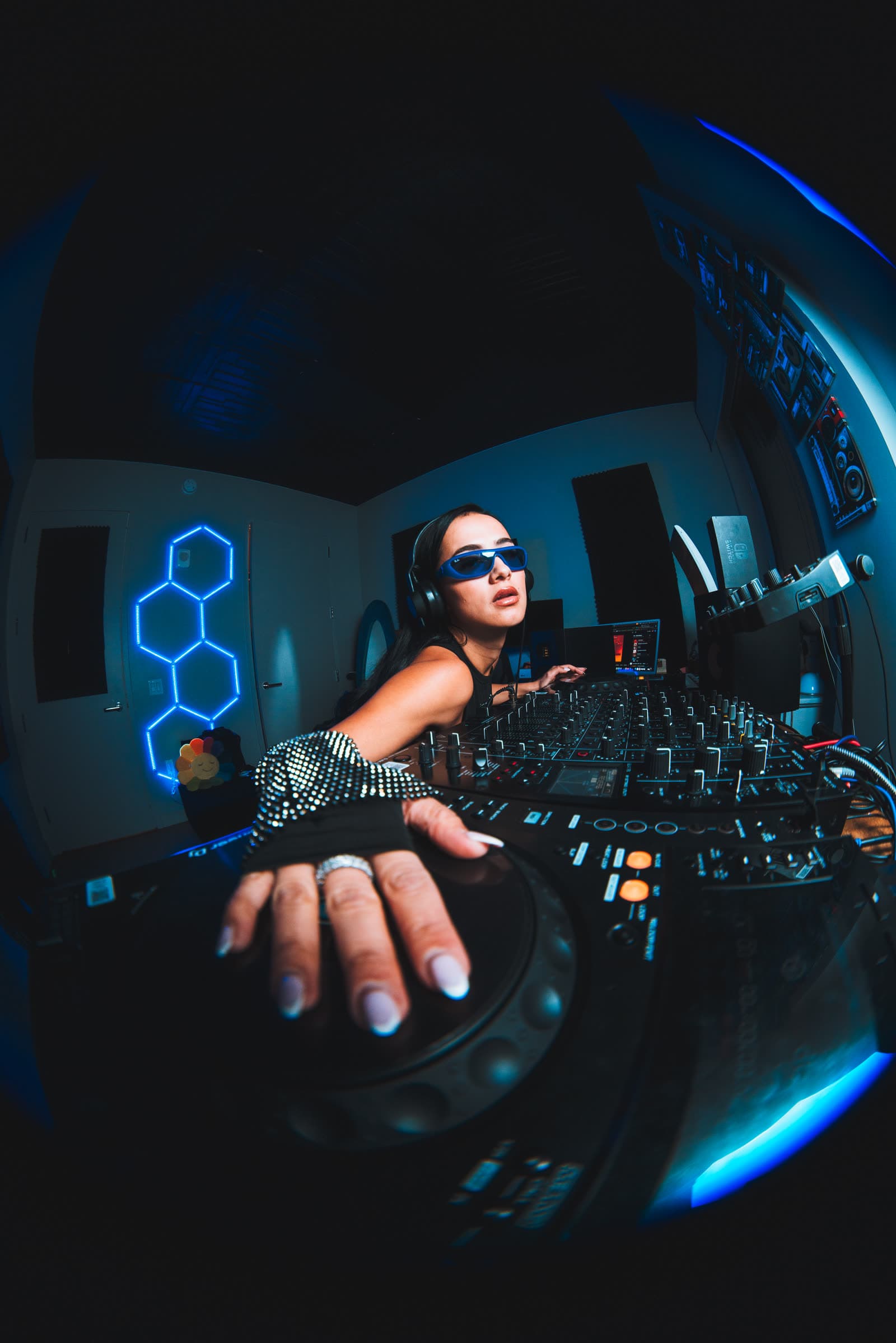 CICIBI on the decks under blue neon